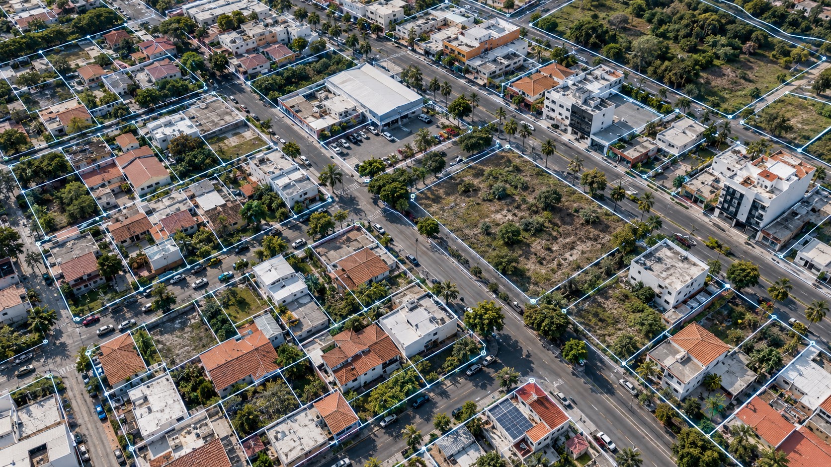 Vista aérea ilustrativa generada con IA de una zona urbana y parcelas delimitadas mediante líneas digitales catastrales